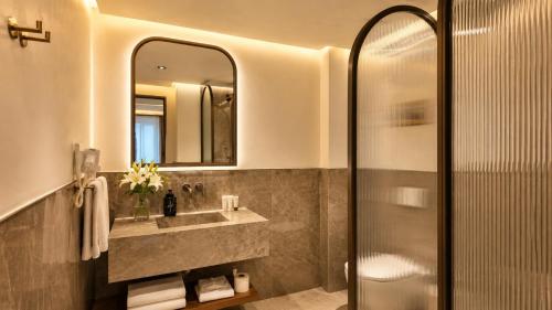 a bathroom with a sink and a shower at Alaturka Mansion in Istanbul