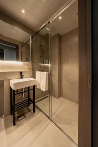 a bathroom with a sink and a shower at My Me Hotel in Seoul