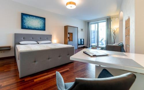 a bedroom with a bed and a table and chairs at Ferienvilla Bad Schandau in Bad Schandau
