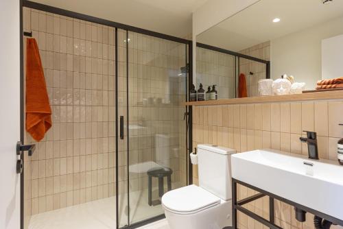 a bathroom with a shower and a toilet and a sink at Be Casa Barakaldo in Barakaldo