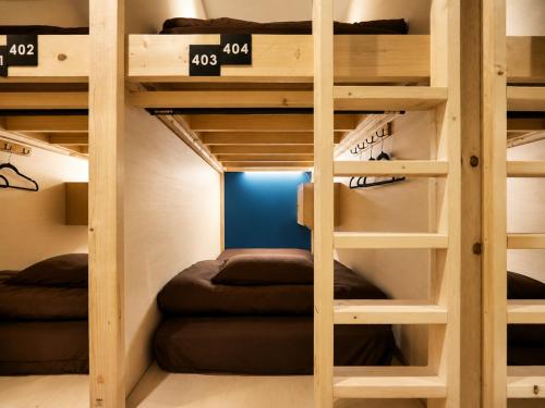 a bunk bed room with two bunk beds in a room at Akasaka Guesthouse HIVE in Tokyo