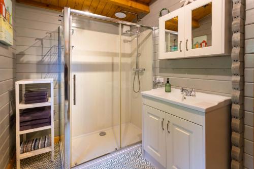 a bathroom with a shower and a sink at Oakbank Farm in Lamlash
