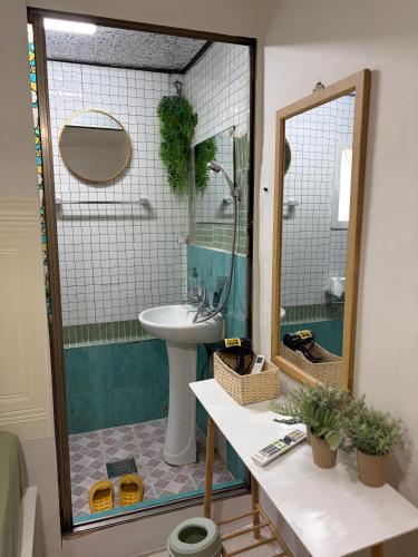 a bathroom with a sink and a toilet and a mirror at Stay Everyday in Seoul