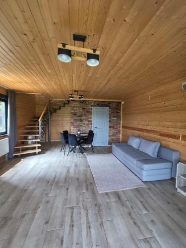 a living room with a couch and a table at Гірська Лаванда in Skhidnitsa