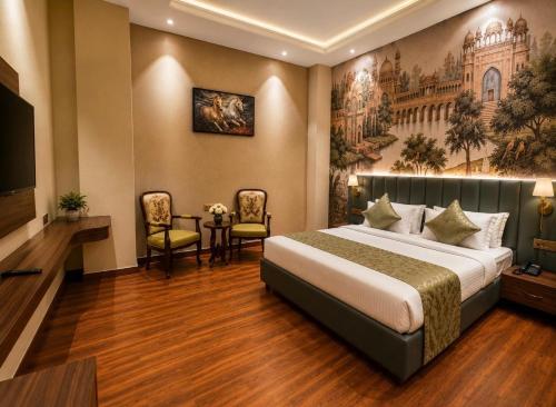 a hotel room with a bed and a tv at Emerald Resorts and Hotel in Jāmb