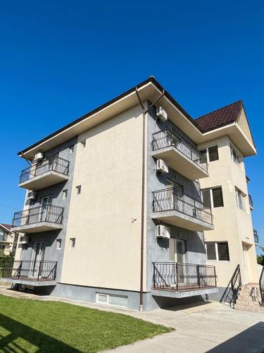 a large apartment building with balconies on it at Vila Diana in Venus