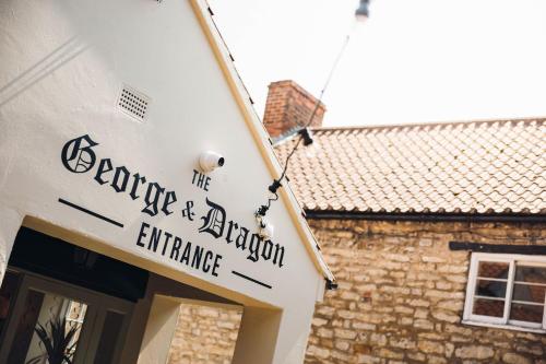 a sign for the entrance to the exchange and exclusion entrance at George & Dragon Hotel in Kirkbymoorside
