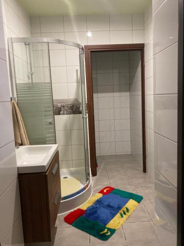 a bathroom with a shower and a sink and a mirror at Texaco in Kazimierz Dolny