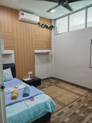 a bedroom with a bed in a room at Jazepuri - Jaze 2 in Kuching