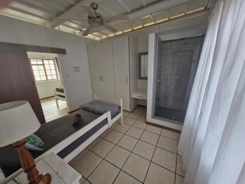 a living room with a couch and a window at Journey Guesthouse in Riversdale