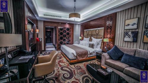 a hotel room with a bed and a couch at Casablanca Grand Hotel in Jeddah