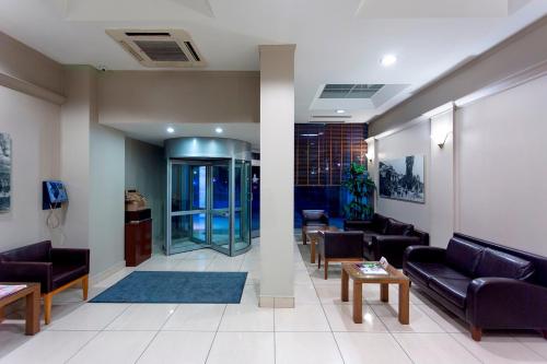 a living room with couches and tables in a building at Kent Hotel in Bursa