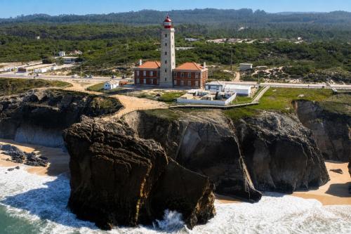 an aerial view of a lighthouse on a cliff at Kampaoh São Pedro de Moel in Marinha Grande