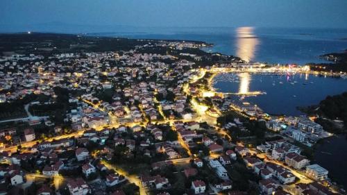 an aerial view of a city at night at Apartments Vukalovic in Medulin