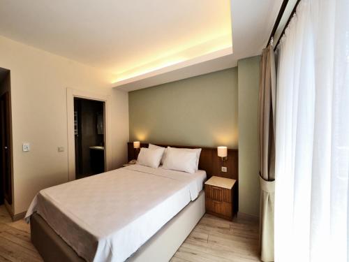 a bedroom with a large bed and a window at Hotel Lina Oldcity in Istanbul