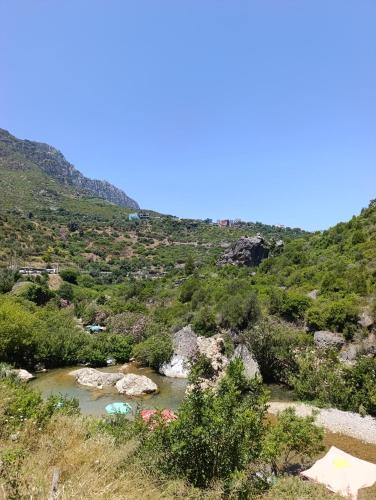 a river in the middle of a mountain at Casa Yessef Akchour in Akchour