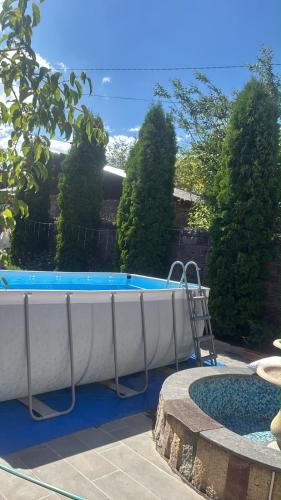 a large swimming pool in a yard next to at HIN TUN NAR-DOS Street in Gyumri