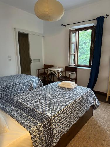 a bedroom with two beds and a window at Casa Filita 'Old Town Traditional House' in Kos