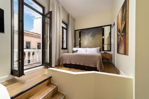 a bedroom with a bed and a large window at Miapera Hotel & Spa - Special Class in Istanbul