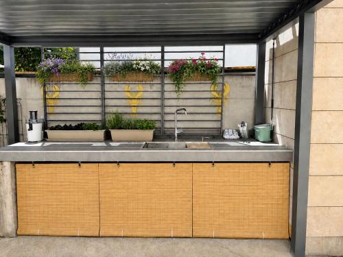 a kitchen with a sink and some plants at St.Barth Apartments in Šibenik