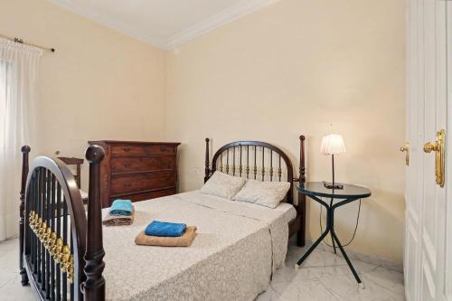 a bedroom with a bed and a side table at Beach 2-bedroom in Los Cristianos in Los Cristianos