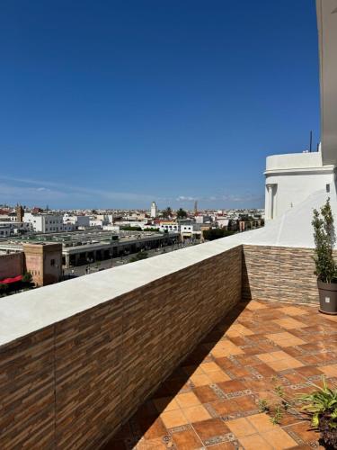 a view of the city from the roof of a building at Hôtel Majestic Rabat Centre in Rabat