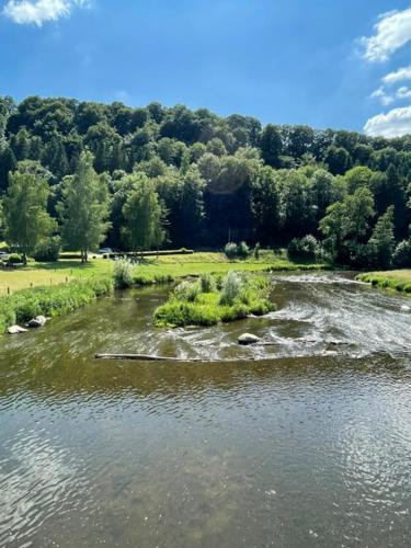a river with rocks in the middle of it at Chassepierre's Soul in Chassepierre