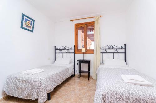 Ένα ή περισσότερα κρεβάτια σε δωμάτιο στο Villa César