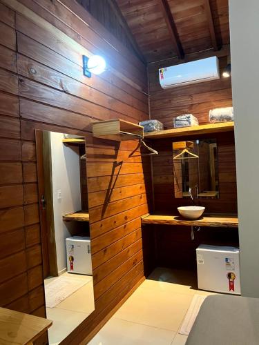 a bathroom with a sink and a mirror at Hotel Pousada Gavi e Nono in Santa Ernestina