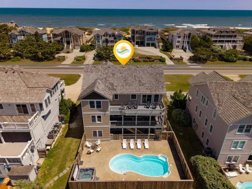 an aerial view of a house with a pool and a balloon at 6118 - Ferrari II in Nags Head