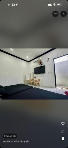 a room with a room with a table and a window at Hera motel in Xã Như Lâm