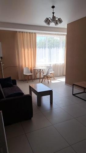 a living room with a couch and a table at Urban Harmony in Tsalka