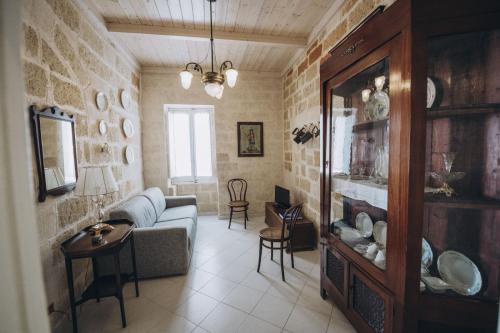 a living room with a couch and a table at Dei Serafini in Polignano a Mare