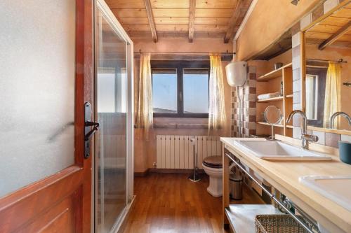 a bathroom with a sink and a toilet at Nerbone Farm Retreat in Perugia