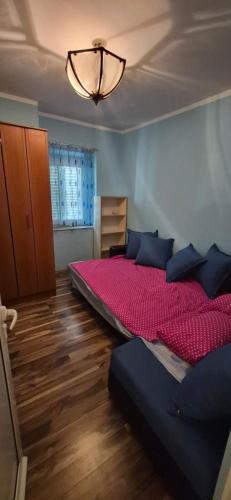 a bedroom with two beds and a chandelier at Old town Budva D&M in Budva