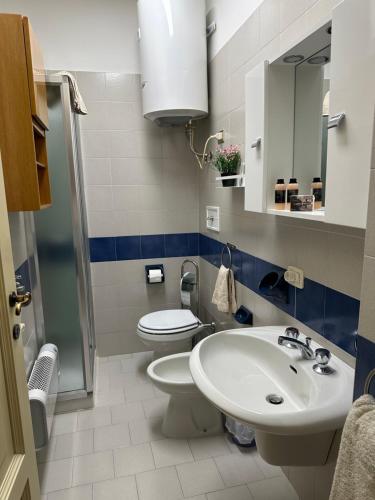 a bathroom with a sink and a toilet at La Contessa - Lenno in Lenno