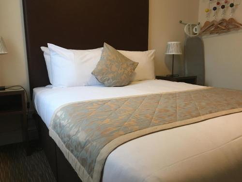 Ένα ή περισσότερα κρεβάτια σε δωμάτιο στο The Star and Garter Hotel