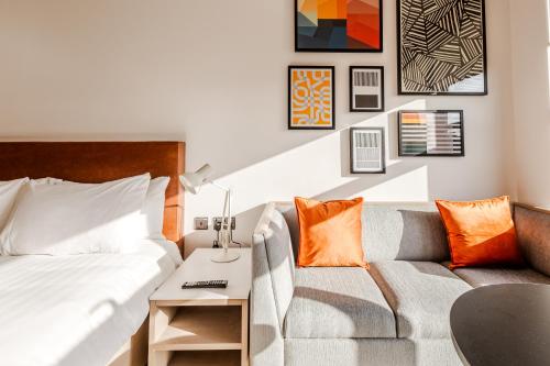 a living room with a couch and a table at The SPACE To Stay Aparthotel in St. Andrews