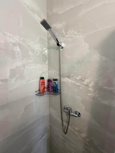 a bathroom with a shower with a shower head at Apartment Amila in Jajce