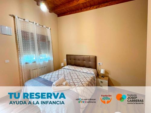 a small bedroom with a bed in a room at Posada de Ongayo in Suances