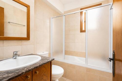 a bathroom with a sink and a shower at Villa Serena in Pomos