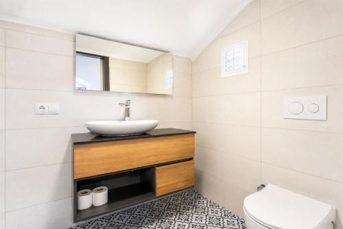 a bathroom with a sink and a toilet at Villa Deniz Paradise in Dalyan