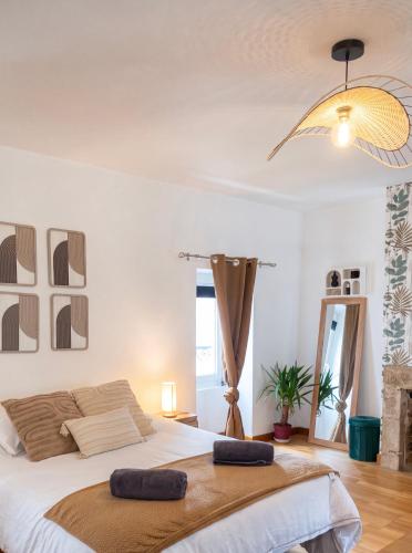 a bedroom with a bed with two pillows on it at Cozy & Stylish, hyper center in Quimper