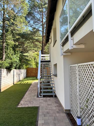 a set of stairs leading up to a house at Trzy Tarasy Swornegacie in Swornegacie