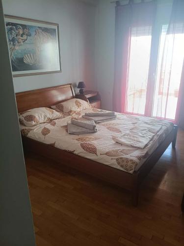 a bedroom with a large bed with pillows on it at Lamia House in Lamía