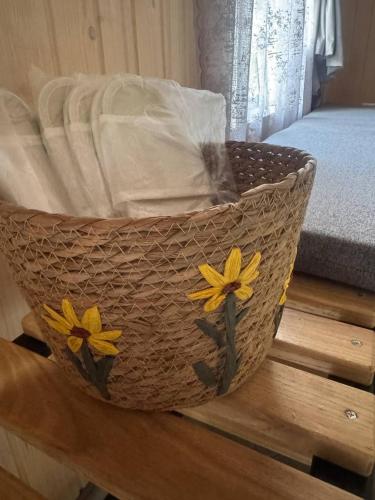 a basket with flowers on it sitting on a table at Медовий сон in Pasichna