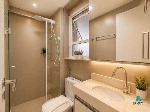 a bathroom with a toilet and a sink and a shower at My Way by Holiday Stays in Fortaleza