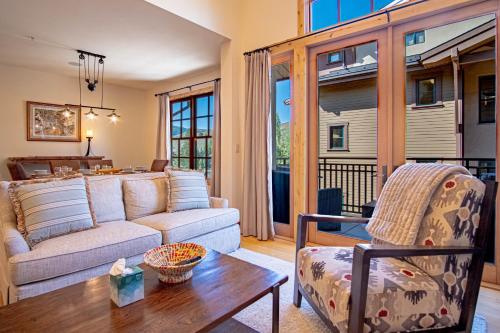 a living room with a couch and a table at Elkhorn View Retreat in Sun Valley