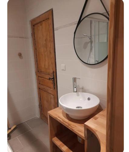 a bathroom with a white sink and a mirror at Duplex centre historique frejus in Fréjus