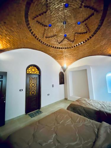 a room with a bed and a circular ceiling at Rahma House Hostel in Tunis